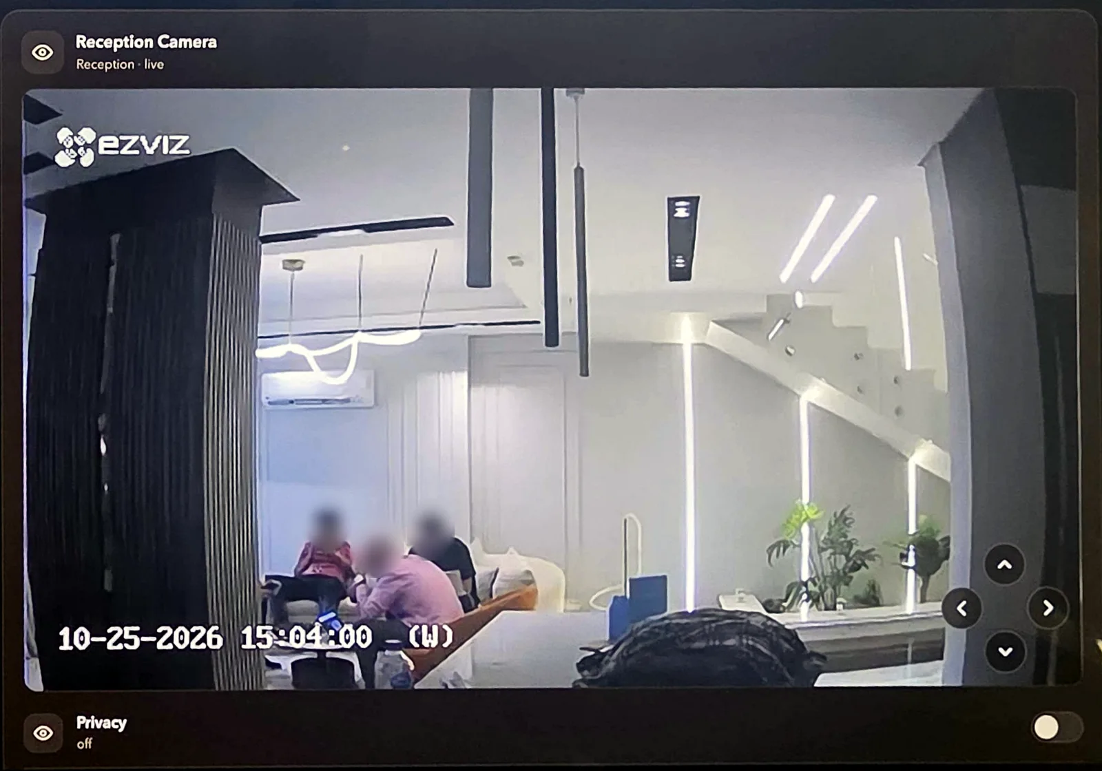 The Reception Camera card in the Living Yards app on an iPad, showing the live feed of The Loft reception with pan and tilt arrows